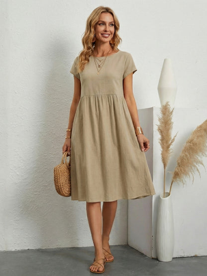 ELEGANTE ABITO CON TASCHE